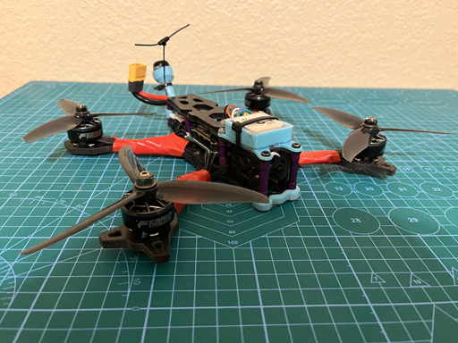 FPV drone for reference, ESC has the motor wires on the bottom, above that is the Flight Controller. The GPS/Compass is the box on the front